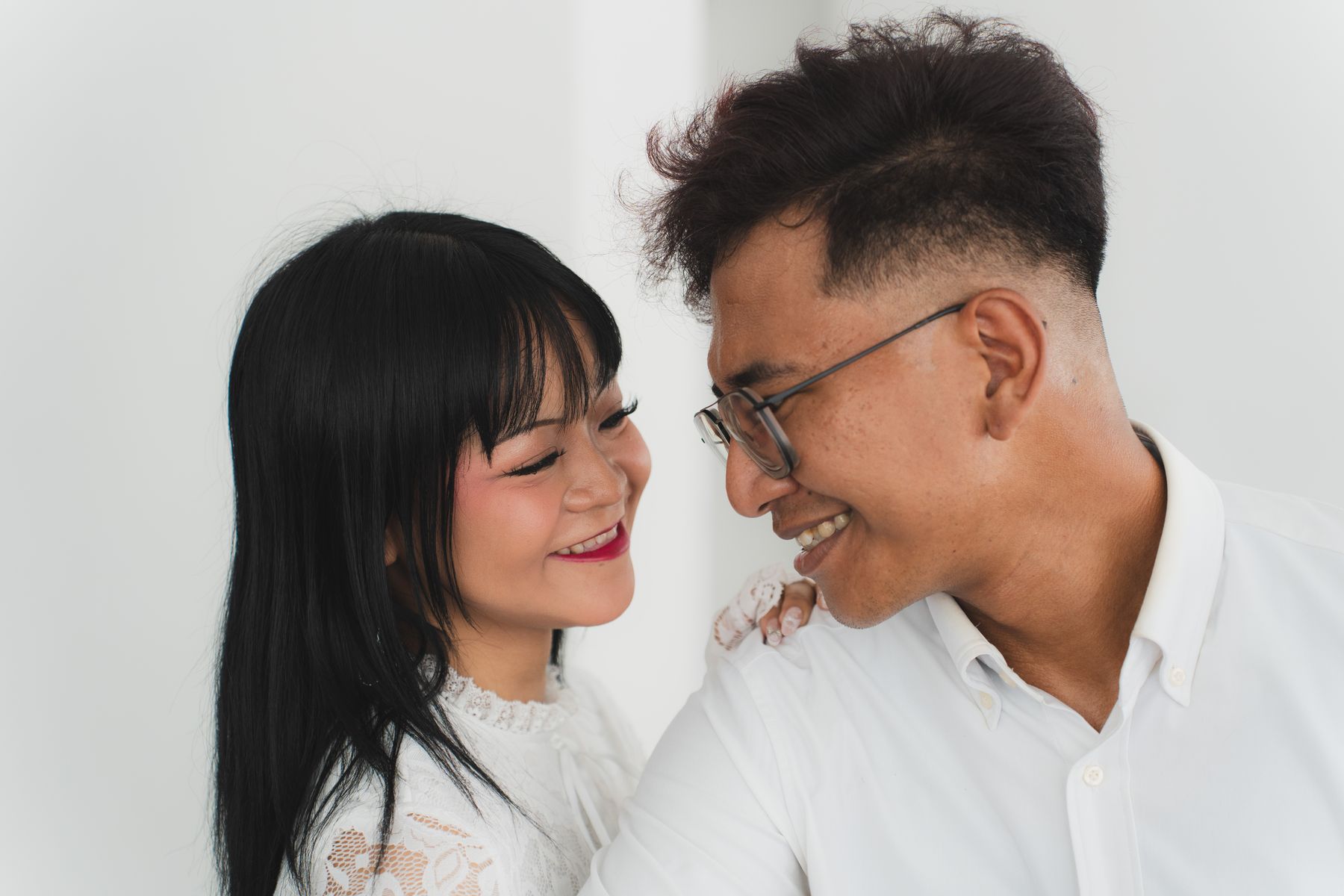 Couple laughing in an embrace