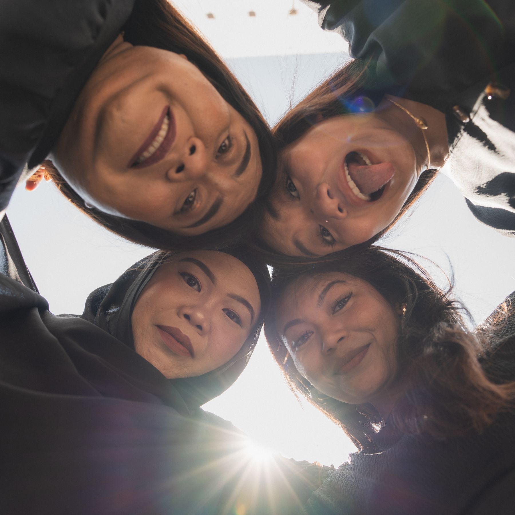 Playful low-angle group selfie