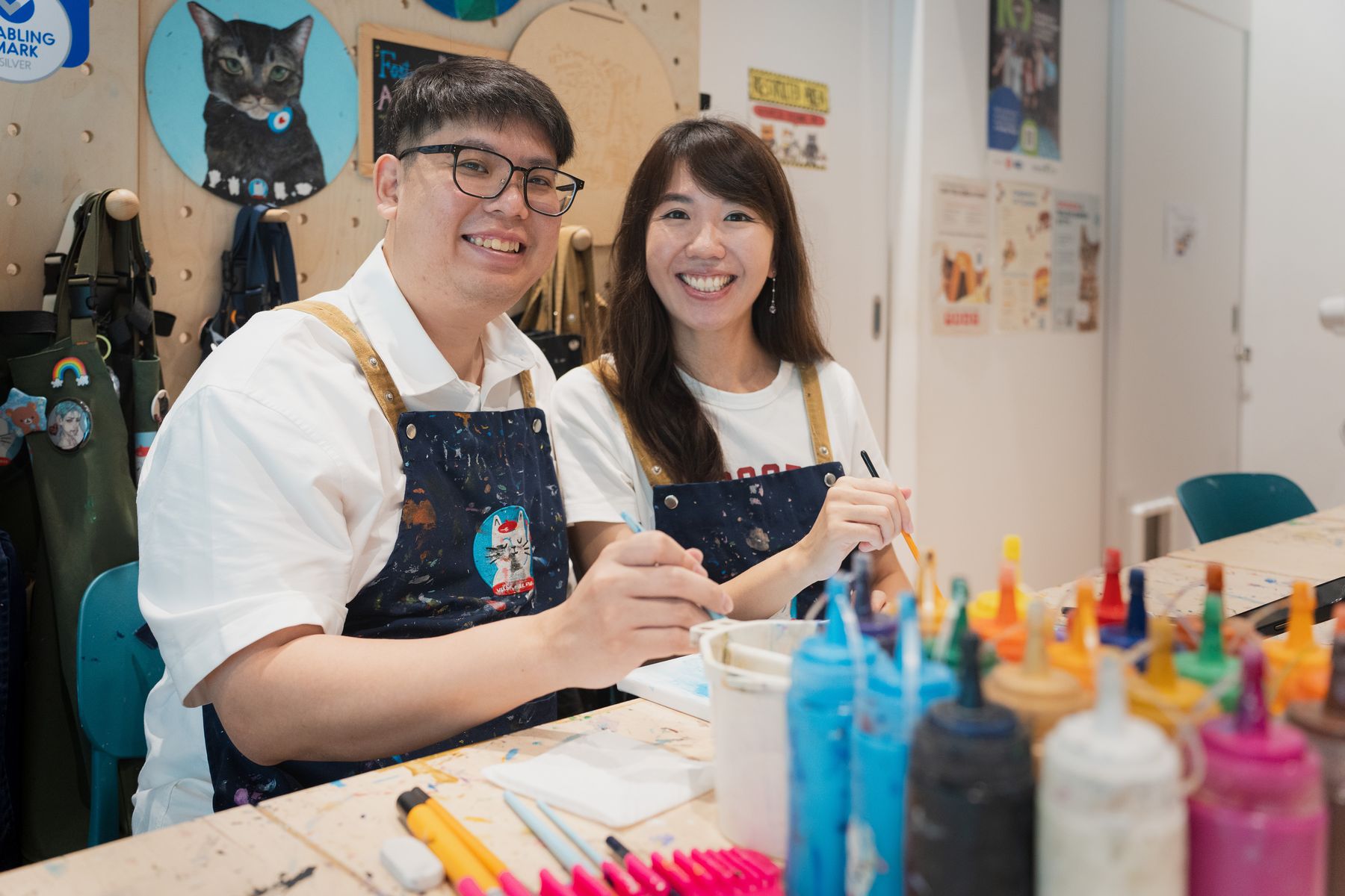 Couple laughing at a painting table