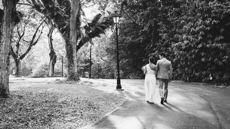 The couple on a lamplit garden path, black and white
