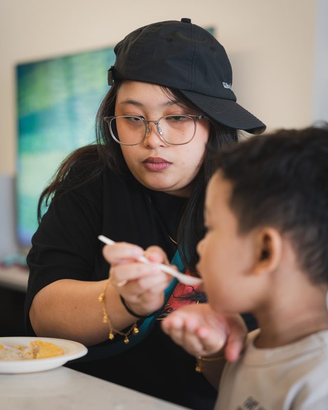 Feeding a child at the dining table