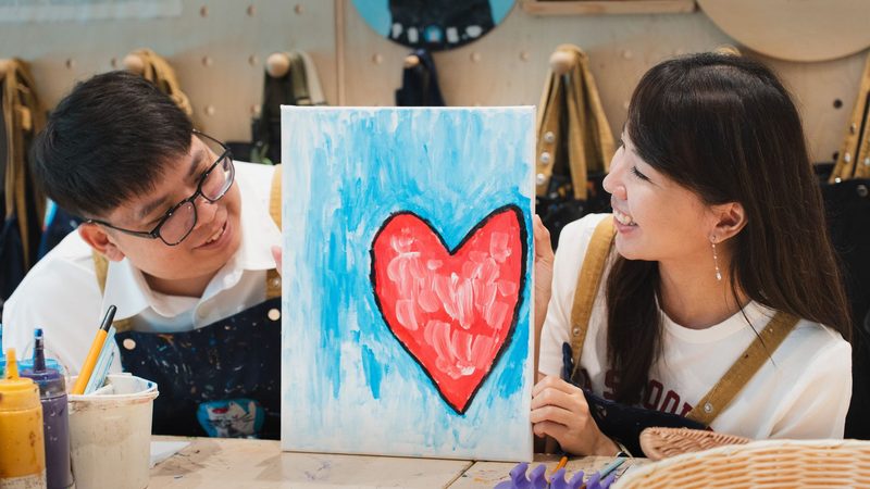 Looking at each other over the finished painting