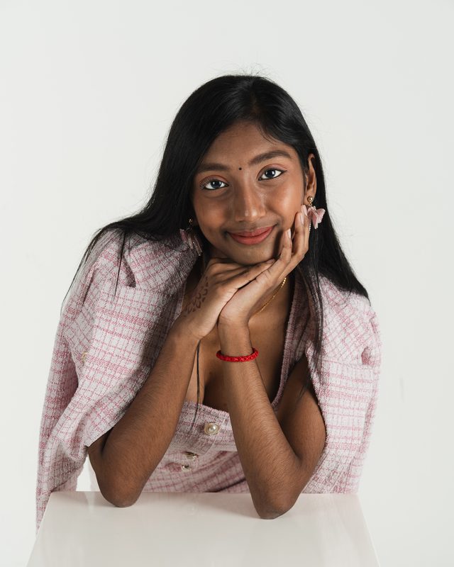 Roma resting her chin on her hands