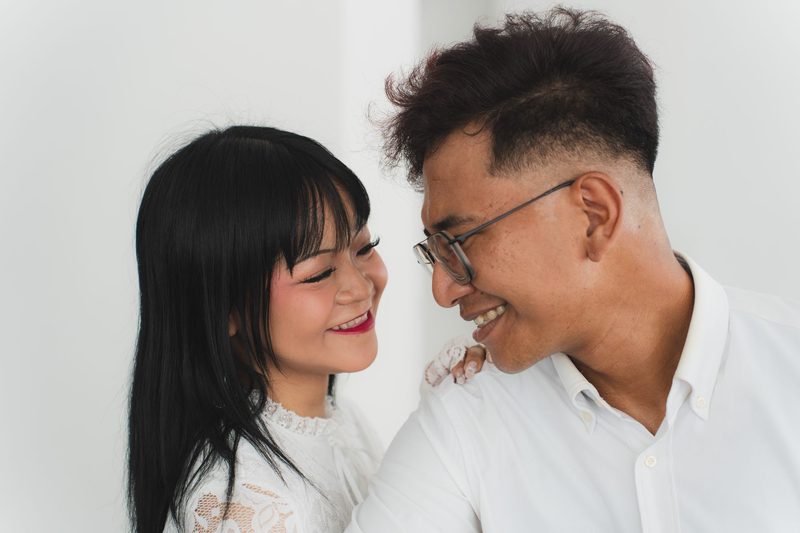 The couple laughing in an embrace